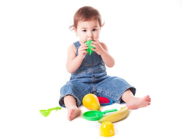 Baby girl playing with kitchen toys