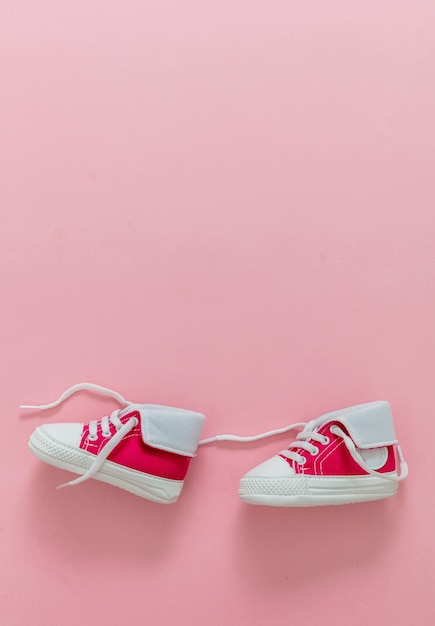 Premium Photo | Baby girl shoes on pastel pink color background copy space