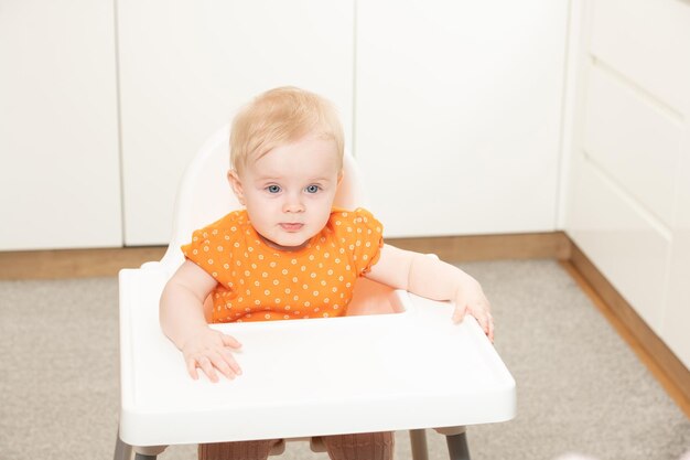 Baby Girl Sitting on Chair Waiting for Meal