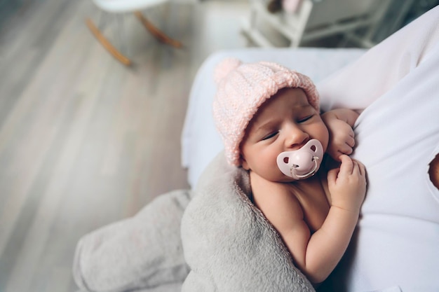 Baby girl with pacifier sleeping