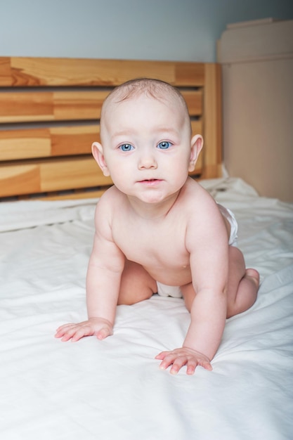 Baby girl year old on bed close up