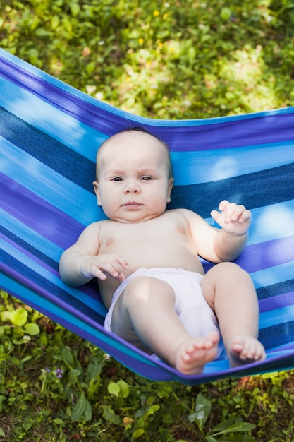 Baby in a hammock enjooys and relaxing