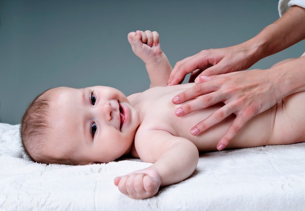 Baby hand holding mother finger