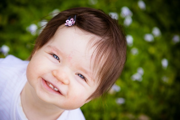 A baby has fun in the garden on a summer's day