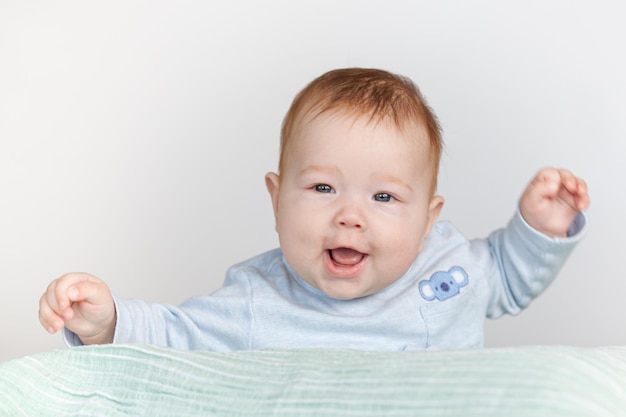 baby having fun lying on his stomach