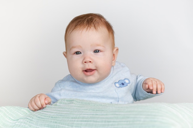 baby having fun lying on his stomach