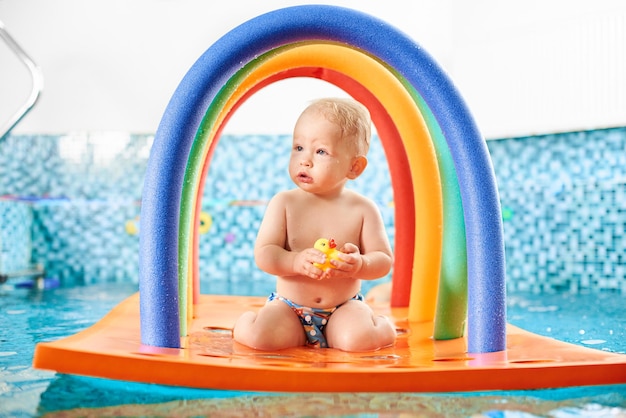 Baby having fun in the swimming pool