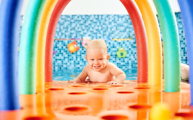 Baby having fun in the swimming pool