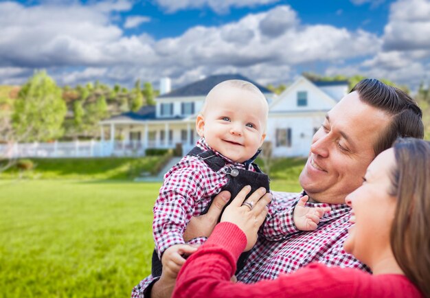 Baby Having Fun With Mother and Father Out Front