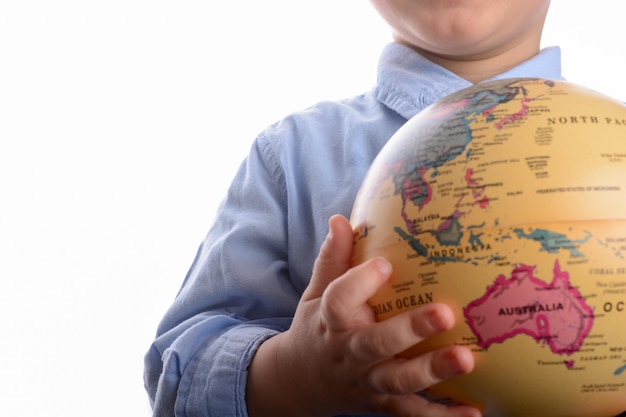 Baby holding a globe