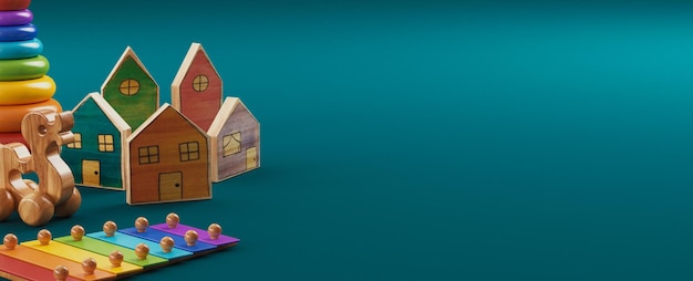 Фото Детские детские игрушки баннер фон. красочные образовательные деревянные игрушки на синем фоне. 3d визуализация