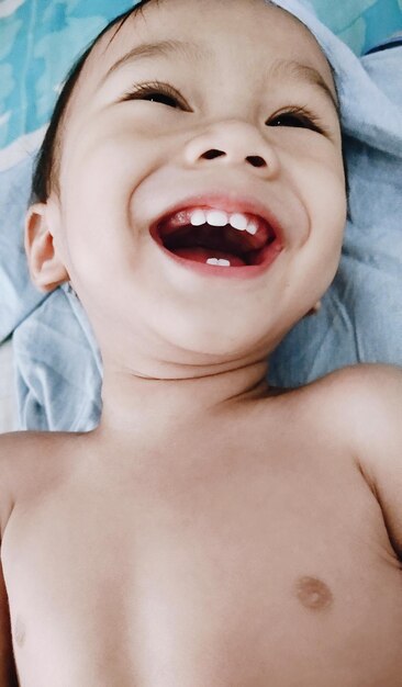 Baby laughing after taking a bath