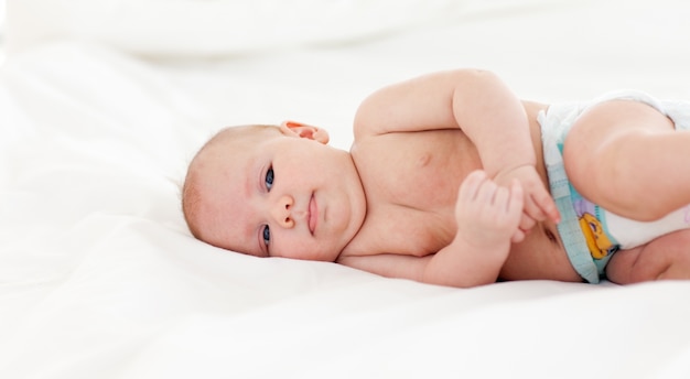 Baby lying in bed