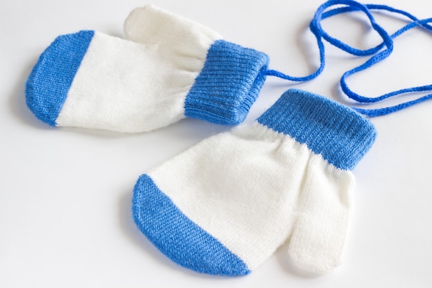 Photo baby mittens on a white background