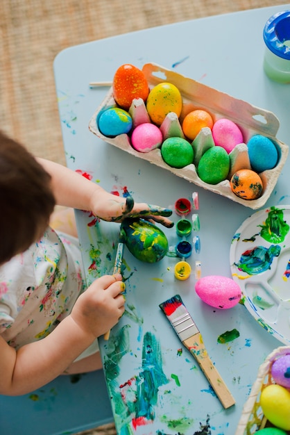 Baby Painting Easter Eggs