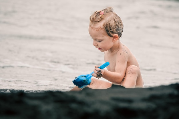 Baby playing on the beach