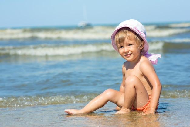 Baby playing on the beach