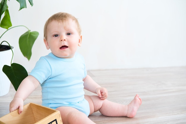 Baby playing with colorful blocks on the floor