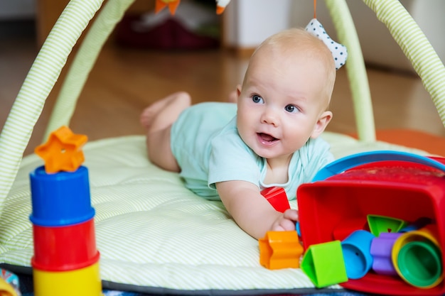 Baby playing with colorful toys