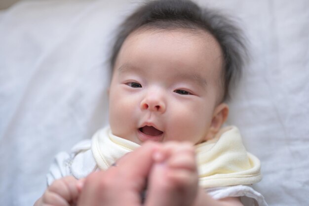 baby playing with curtains