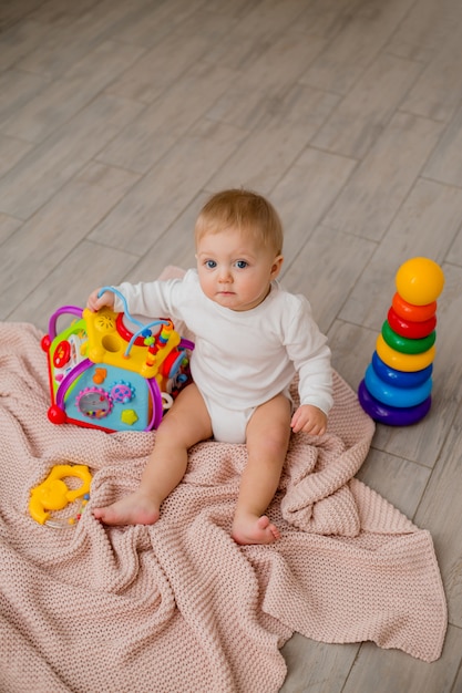 baby playing with educational toys at home