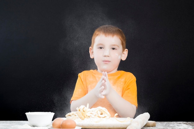 Baby playing with flour in the kitchen