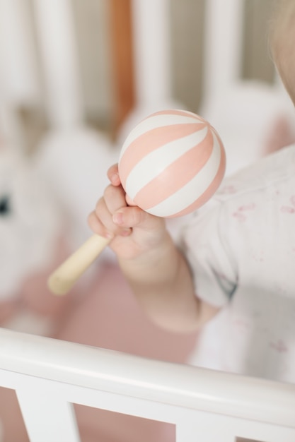 baby playing with wooden toy 