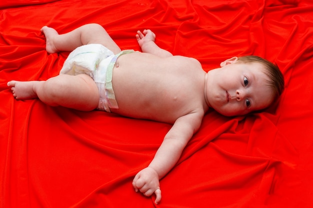 Baby on a red cloth