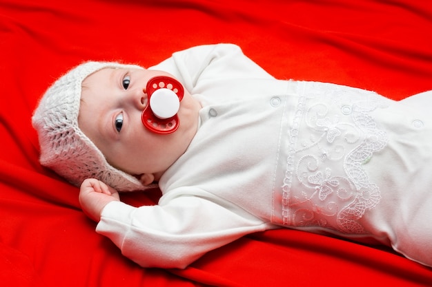 Baby on a red cloth