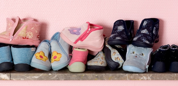 Baby's shoes on a shelve at the nursery