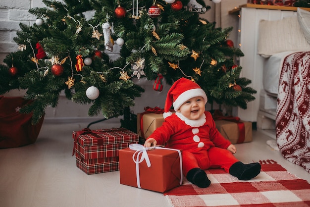 Baby in santa claus costume. Newyear