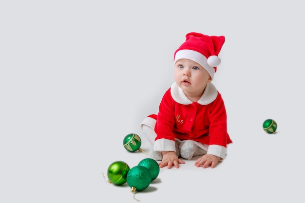 A baby in a Santa Claus costume