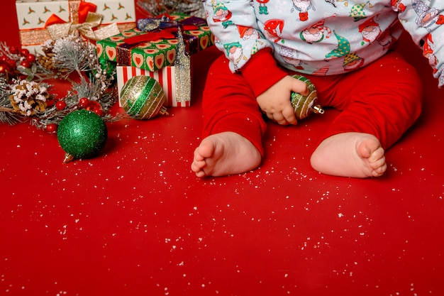 Baby santa with christmas gifts or presents