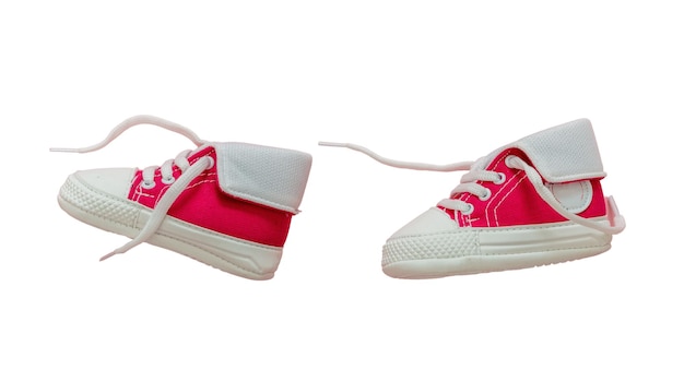 Baby shoes red pink color isolated cutout flying on white color background