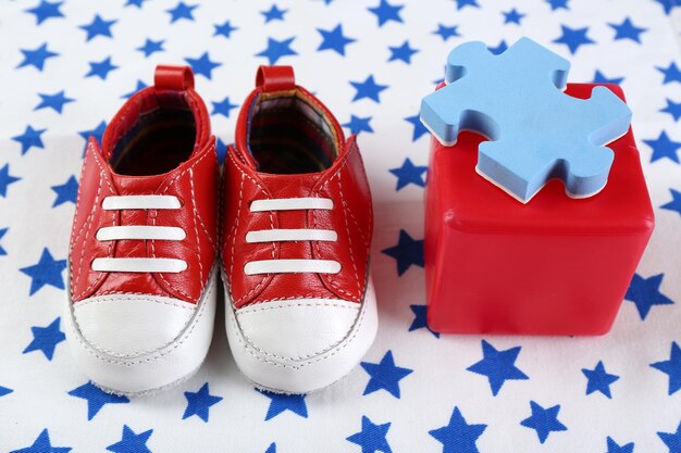 Photo baby shoes on spotted white background