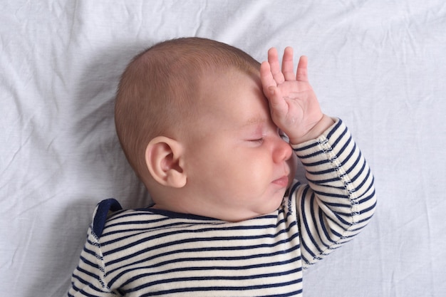 A baby sleeping in bed