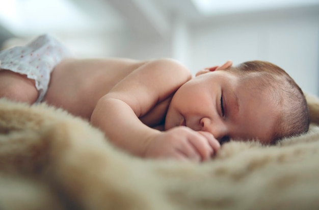 Baby sleeping on a blanket