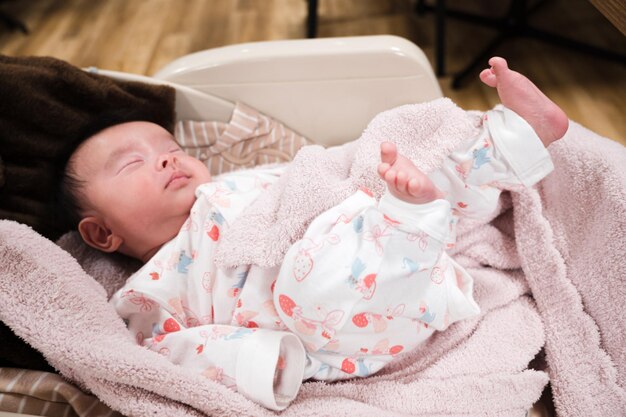 baby sleeping on bouncer