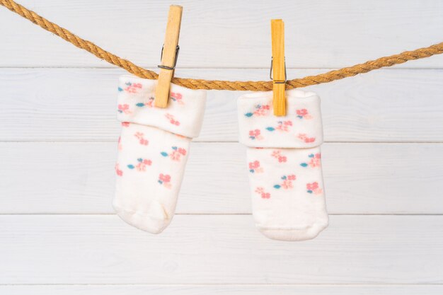 Baby socks on a clothesline. Baby clothes washing