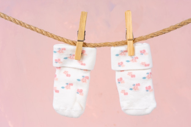 Photo baby socks on a clothesline. baby clothes washing