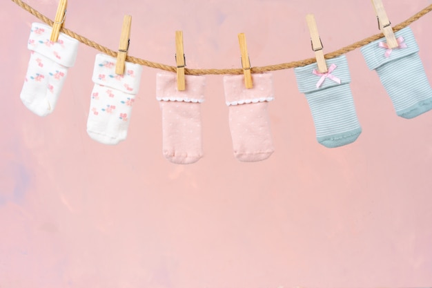 Baby socks on a clothesline. Baby clothes washing