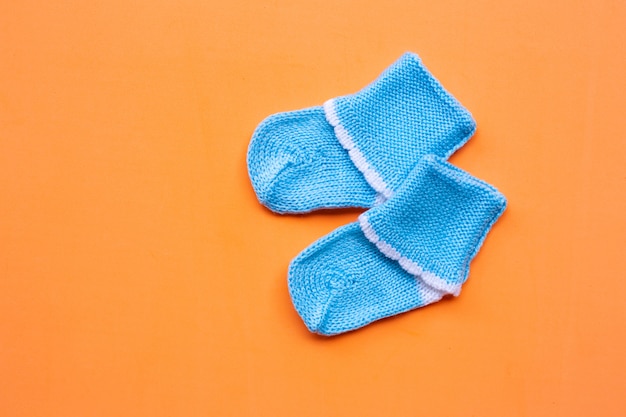 Baby socks on orange