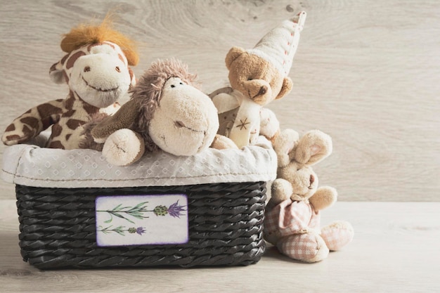 Baby soft toys in a wicker basket