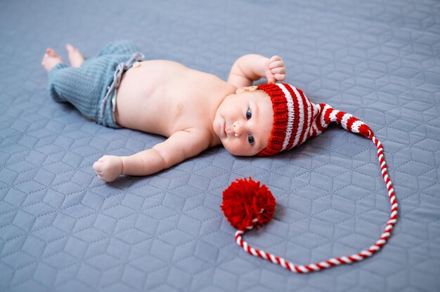 Baby two months old in a hat Fashionable little newborn baby boy