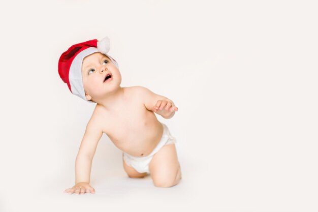 baby wearing santa hat