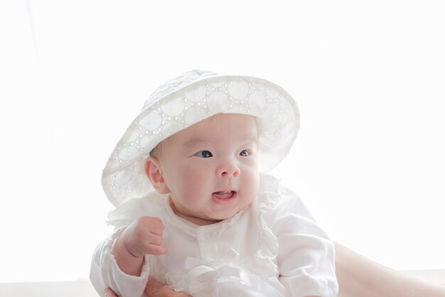 Baby in white clothes