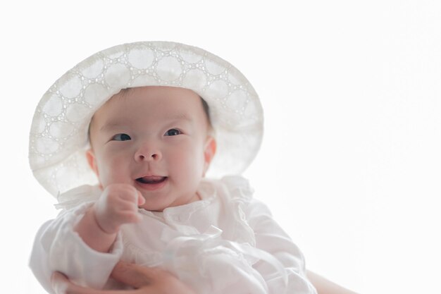 Baby in white clothes