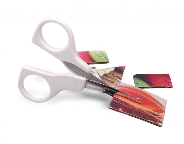 Baby white scissors cut colored paper