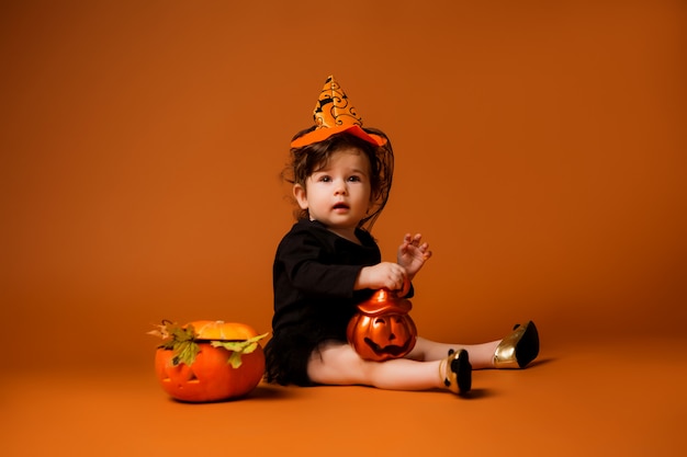 baby in a witch costume for Halloween