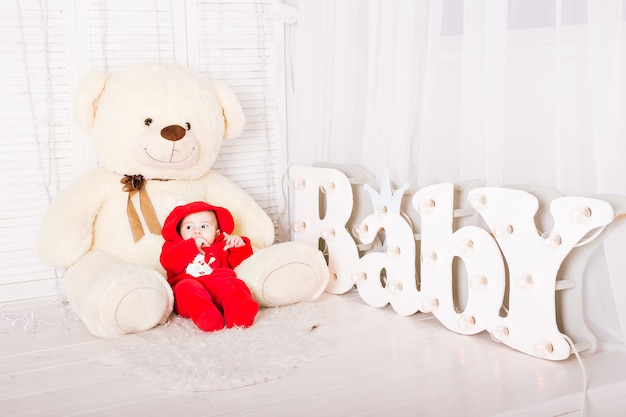 Baby with big teddy bear. Baby shower concept